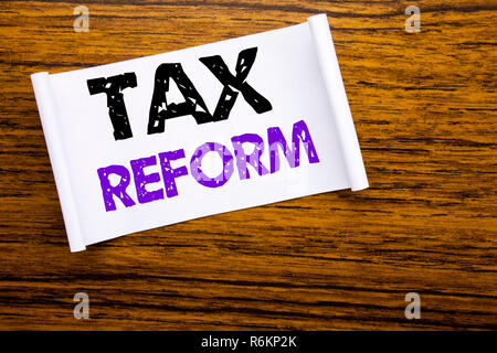 Word, writing Tax Reform. Business concept for Government Change in Taxes written on sticky note paper on the wooden wood structure visible background. Stock Photo