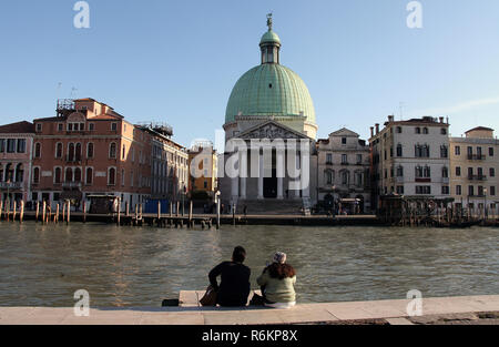 Tourists at the side of the Grand Canal in Venice Stock Photo