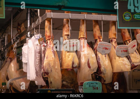 Toledo, Spain - April 27, 2018 - Shop window of appetizing cold cuts and smoked Spanish ham on a spring day Stock Photo