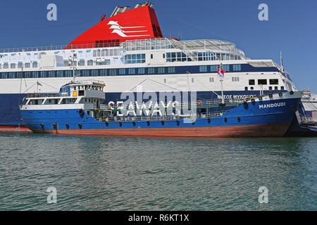 PIRAEUS, GREECE - MAY 04: Refueling Ship in Piraeus on MAY 04, 2015. Seaways Ferry Replenishment With Fuel From Eko Mandoudi Oil Tanker in Port of Pir Stock Photo