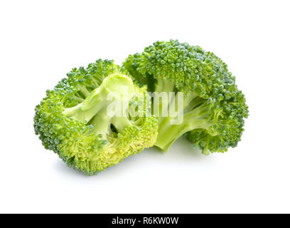 Two pieces of broccoli isolated on white background. Stock Photo