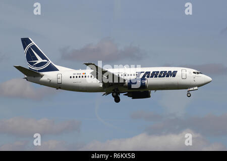 Romanian Tarom Boeing 737-300 with registration YR-BGE on short final for runway 06 of Amsterdam Airport Schiphol. Stock Photo