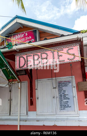 One of the many fish stands that sell fresh cooked fish at the famous fish market at Oistins where fresh caught fish is brought in for sale. Friday and Saturday night is the popular fish fry. Stock Photo