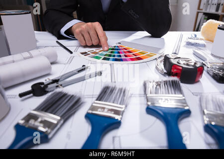 Architect's Hand Choosing Color From Swatch Stock Photo