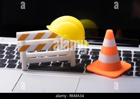 Road Barrier With Hard Hat And Traffic Cone Stock Photo