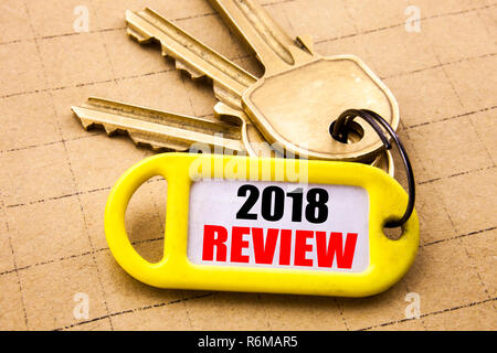 Word, writing 2018 Review. Business concept for Feedback On Progress Written on key holder, textured background close up. Stock Photo