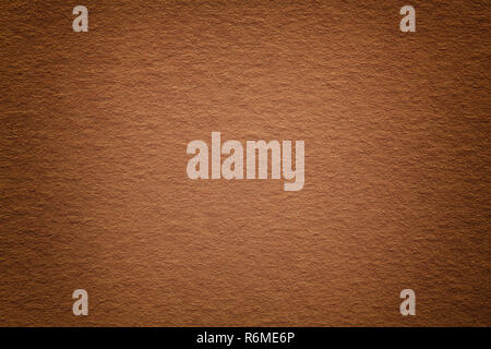 Texture of vintage dark bronze paper background with vignette. Structure of dense light brown kraft cardboard with frame. Felt rusty gradient backdrop Stock Photo