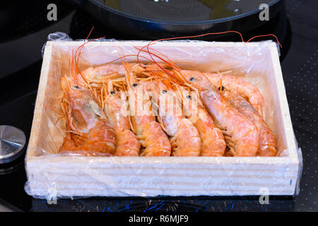 Close up on box with raw shrimps ready for being fried Stock Photo