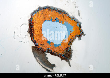 rusty spot on painted plaster wall Stock Photo