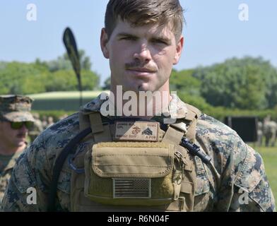 A U.S. Marine Corps range tower NCO assesses wind conditions at Altcar ...