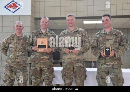 With a combined score of 1538-9X, Capt. Andrew Hahn with the Tennessee National Guard achieved 1st place, Staff Sgt. Micah Fulmer with Colorado National Guard achieved 2nd place with a combined score of 1519-16X, and Spc. Austin Norcross with Colorado National Guard with a combined score of 1513-19X achieved 3rd place. They are presented with CNGB Individual Rifle Championship Plaques by Col. Dennis Humphrey, National Guard Marksmanship Training Center Commander, May 25, 2017 at the completion of the CNGB Postal Matches, hosted by the National Guard Marksmanship Training Center held at Robinso Stock Photo