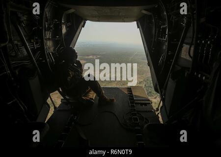 https://l450v.alamy.com/450v/r6n0t9/darwin-australia-us-marine-sgt-phil-berry-weapons-and-tactics-instructor-marine-medium-tiltrotor-squadron-268-marine-rotational-force-darwin-looks-out-the-rear-of-an-mv-22b-osprey-as-they-make-their-way-to-pick-up-a-helicopter-support-team-for-an-external-lift-may-26-2017-this-is-the-ospreys-first-deployment-to-australia-and-has-added-to-the-interoperability-training-capabilities-for-the-australian-defence-force-and-us-marines-berry-28-years-old-is-from-annapolis-md-r6n0t9.jpg