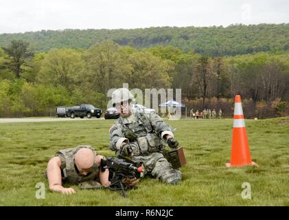 Sgt. Michael Cohen, a member of the D.C. National Guard won the best noncommissioned officer portion of the Region II Best Warrior Competition held at Fort Indiantown Gap May 11-14. One of the Warrior Tasks each Soldier was challenged with completing was to resupply ammunition to an M249 light machine gun emplacement. Stock Photo