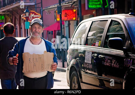 A man panhandles on Bourbon Street, Nov. 15, 2015, in New Orleans, Louisiana. (Photo by Carmen K. Sisson/Cloudybright) Stock Photo