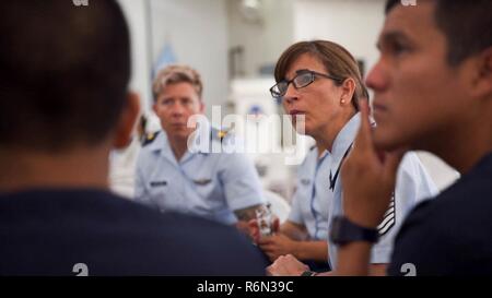 Senior Master Sgt. Felicita Sueiras, Physiology Program Superintendent, Joint Base San Antonio-Randolph, Texas, speaks with Peruvian medical technicians during a subject matter expert exchange in Lima, Peru, May 17, 2017.  The global health exchange brought U.S. and Peruvian counterparts together to strengthen and sustain good relationships with a partner nation. Stock Photo