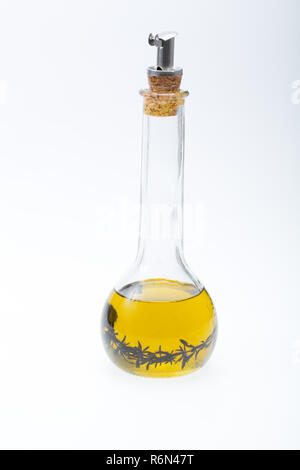 Thyme infused olive oil over white background Stock Photo