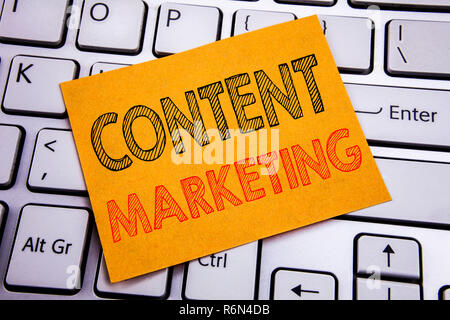 Conceptual hand writing text caption inspiration showing Content Marketing. Business concept for Online Media Plan written on sticky note paper on the white keyboard background. Stock Photo
