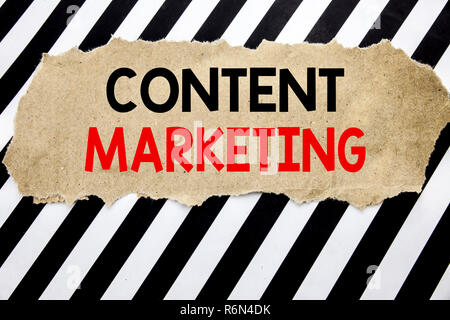 Handwritten text showing Content Marketing. Business concept writing for Online Media Plan Written on note paper, black background with space. Stock Photo