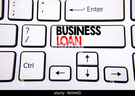 Hand writing text caption inspiration showing Business Loan. Business concept for Lending Finance Credit written on white keyboard key with copy space. Top view. Stock Photo