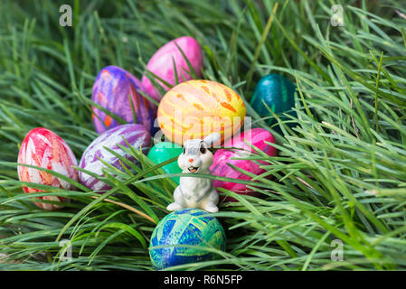 Easter bunny and eggs on the green grass Stock Photo