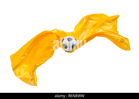 Soccer ball and Smooth elegant transparent yellow cloth isolated or separated on white studio background. Stock Photo