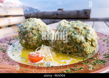 austrian spinach dumplings on a table Stock Photo