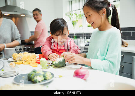 Children Helping to Prepare Dinner Stock Photo