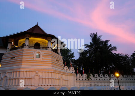Sunset over the temple of the sacred tooth relic in Kandy, Sri L Stock Photo