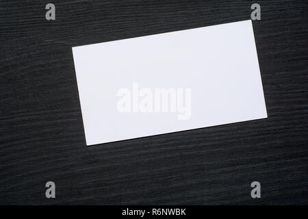 Business cards Mockup on black wooden background. Flat Lay. Copy space for text Stock Photo
