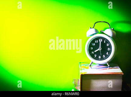 Alarm clock with book Stock Photo