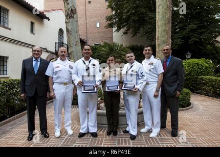 From left to right, Madrid Council President, Luis San Miguel, Captain Michael MacNicholl, Commander Naval Activities Spain, Naval Station Rota Shore Sailor of the Year, PO1 Arturo Novela, Marine of the Year, Corporal Dana Rodriguez, Sea Sailor of the Year, PO1 Charles Winter, Commander Andrew Bates, Officer in Charge, DESRON 60, and Deputy Chief of Missions of the U.S. embassy in Madrid, Krishna R. Urs, pose for a photo with their awards in Madrid, Spain, May 24, 2017. The United States Navy League honors one Sailor, one Sea Service Sailor, and one Marine every year by hosting a ceremony at t Stock Photo