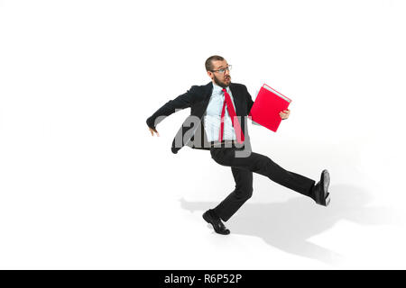 Businessman running with a folder on white background Stock Photo