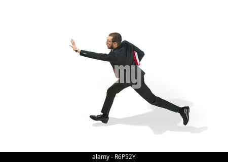 Businessman running with a folder on white background Stock Photo