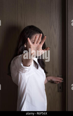 Woman concealing her face Stock Photo