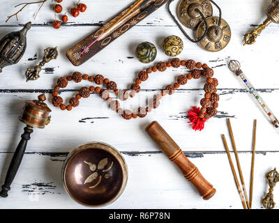 Copper singing bowl, prayer beads, prayer drum, stone balls Stock Photo