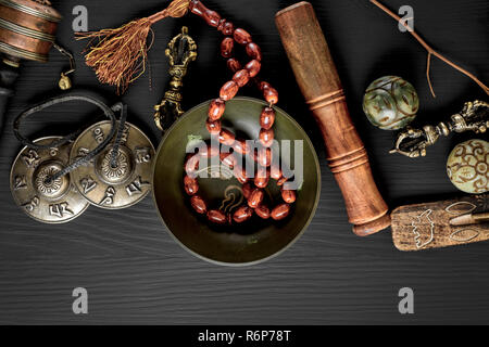 Copper singing bowl, prayer beads, prayer drum Stock Photo