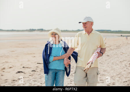 Walking Down the Beach on Holiday Stock Photo