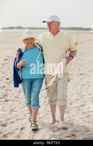 Walking Down the Beach on Holiday Stock Photo