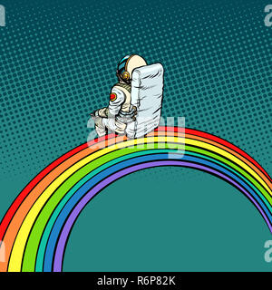 astronaut sits on a rainbow Stock Photo