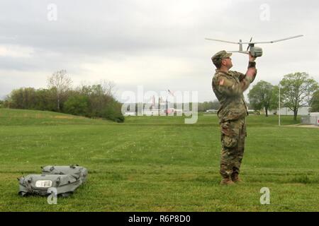 Sgt. Nicholas Hammond, an aviation operations sergeant with Headquarters and Headquarters Company, 1st Battalion, 137th Aviation Regiment, inspects the RQ-11B Raven during training operations April 19, 2017, at Camp Sherman Joint Training Center in Chillicothe, Ohio. The Raven is a Small Unmanned Aircraft System (SUAS) that provides real-time, full-motion video and sensor data to help Soldiers develop situational awareness, enhance force protection and secure routes, points and areas. (Ohio National Guard Stock Photo