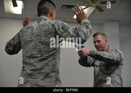 Staff Sgt. William Lamb, 741st Missile Security Forces Squadron tactical response force nuclear advance designated marksman program manager, right, and Airman 1st Class Cristian Hernandez Mendoza, 341st MSFS response force leader, train after being selected to attend Phoenix Raven training May 25, 2017, at Malmstrom Air Force Base, Mont. Three Airmen from Malmstrom have been selected to attend Phoenix Raven training, a first for Air Force Global Strike Command. Stock Photo