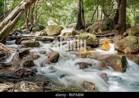 Creek flowing through rocks at Jourama Falls, Ingham, Qld AU Stock Photo