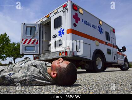 A U.S. Army soldier simulates injuries from a chemical attack during ...