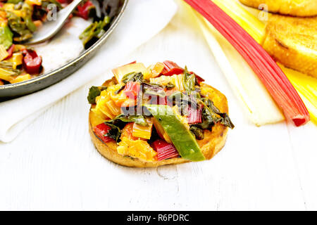 Bruschetta with chard and orange on table Stock Photo