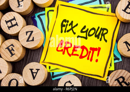 Handwriting Announcement text showing Fix Your Credit. Business photo showcasing Bad Score Rating Avice Fix Improvement Repair written on wooden abckground with letters Stock Photo