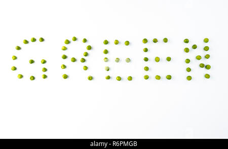 word GREEN made from green peas on white background isolated Stock Photo