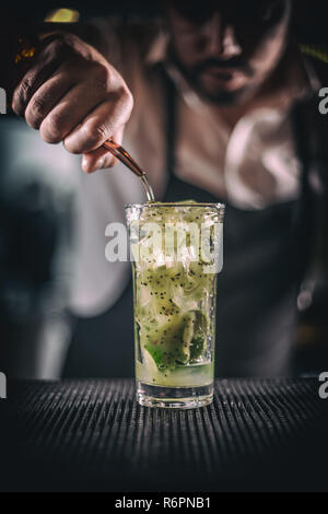 Man hands pouring alcoholic drink Stock Photo