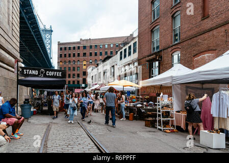 New York City, USA - June 24, 2018: Brooklyn Flea Market in DUMBO. It includes vendors of furniture, vintage clothing, collectibles and antiques, jewe Stock Photo
