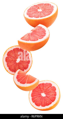 Slices grapefruit flying in the air isolated on white background. Clipping Path. Full depth of field. Stock Photo