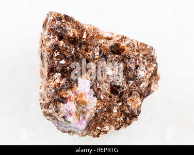 raw Phlogopite with corundum crystal on white Stock Photo